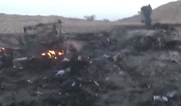 Debris and fire of F 15 Fighter jet